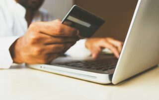 man paying online with card