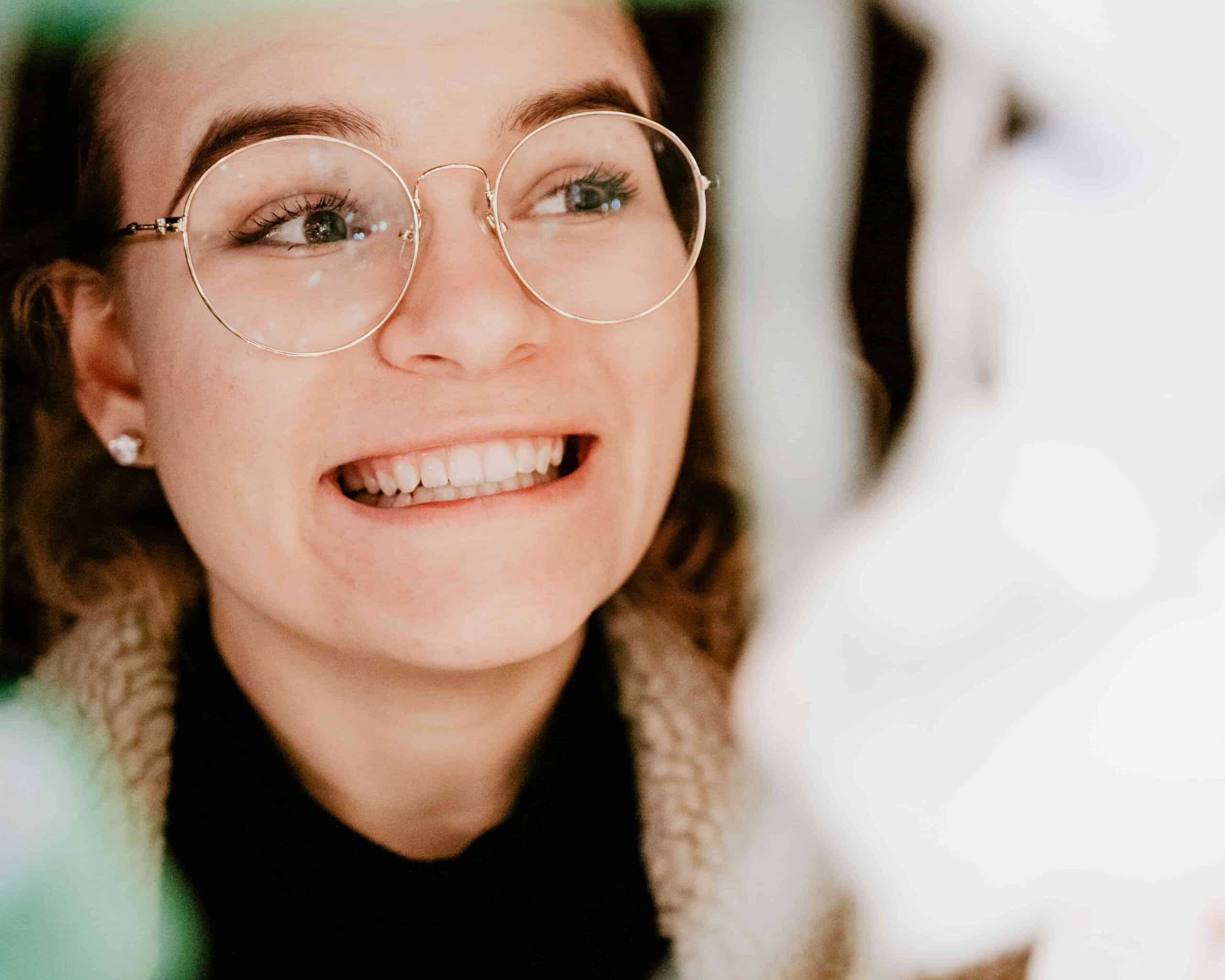 Treat Yourself: Top 5 Post-Dentist Spots in Inglewood, CA 6 girl with glasses smiling with straight teeth