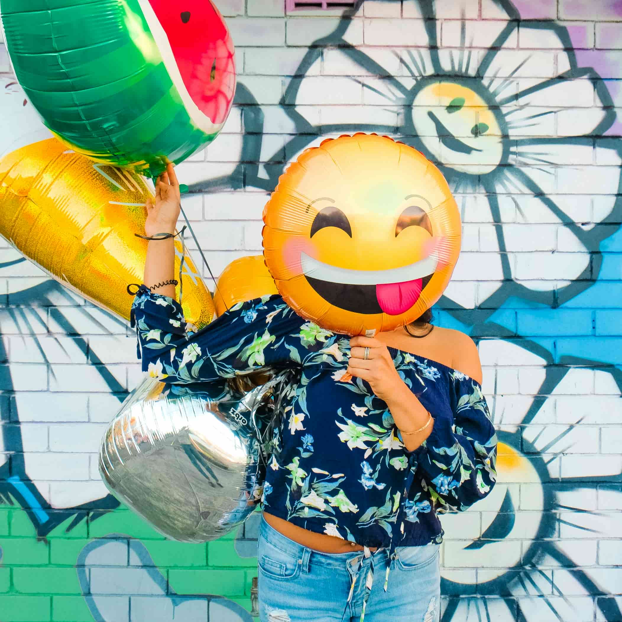 Protect Your Smile in the Southern California Lifestyle 6 girl holding smiling face balloon infront of face