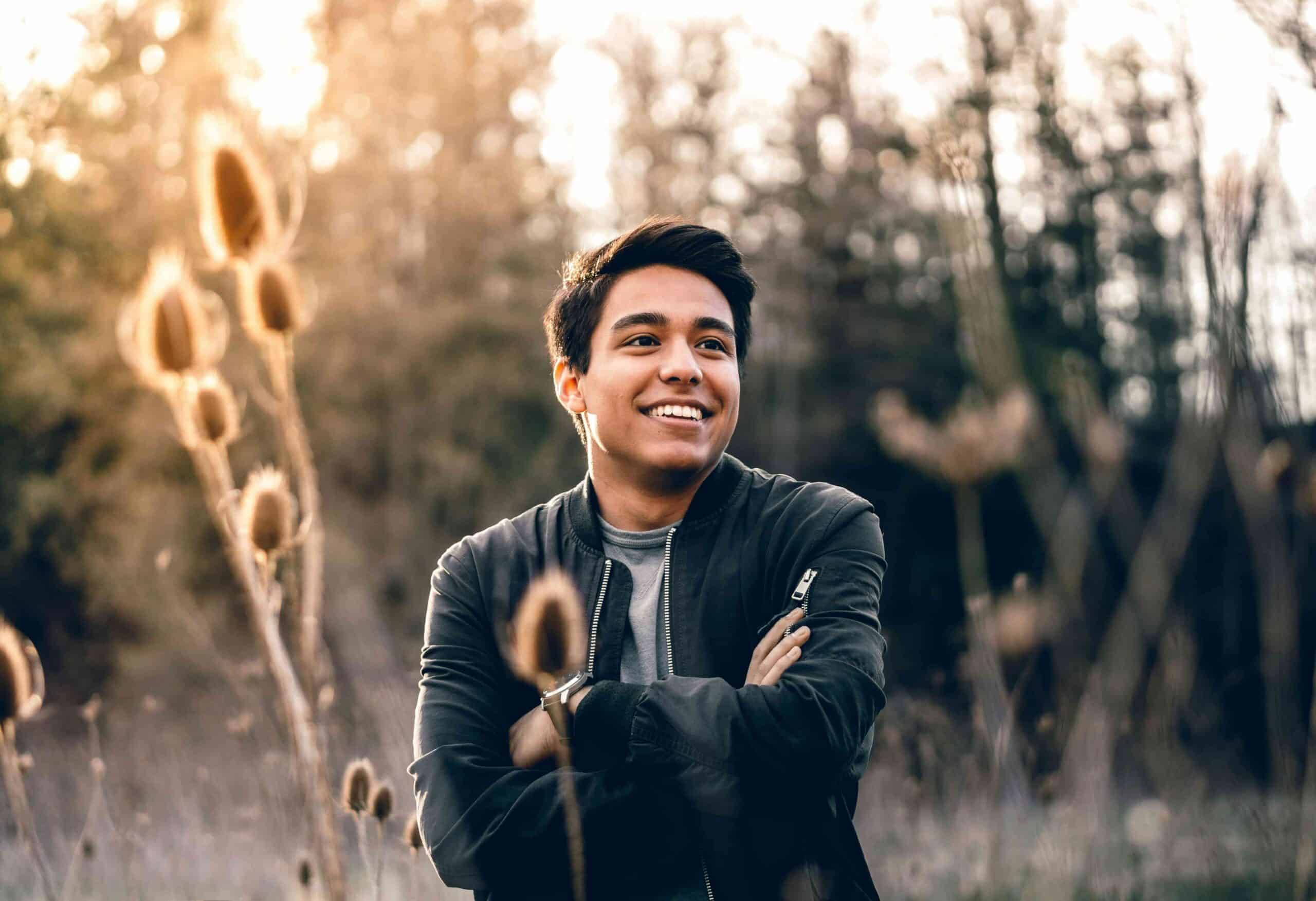 Protect Your Smile in the Southern California Lifestyle 5 man outside in field smiling with arms crossed