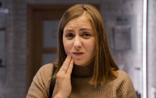 woman with tooth pain